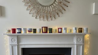 All the christmas candles that I tested, lined up on the fireplace