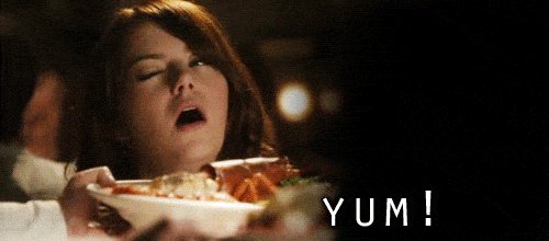 GIF ¦ Woman Saying Yum To a Plate of Food