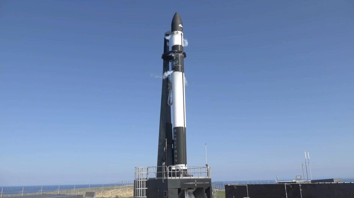 A fueled Rocket Lab Electron booster carrying the R3D2 antenna technology demonstration satellite for DARPA stands atop its Mahia Peninsula launch site in New Zealand during a launch attempt on March 24, 2019 EDT (March 25 New Zealand time).