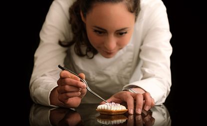 Chef Nina Métayer working on a pastry