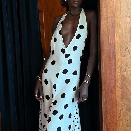 a woman wearing a polka dot dress