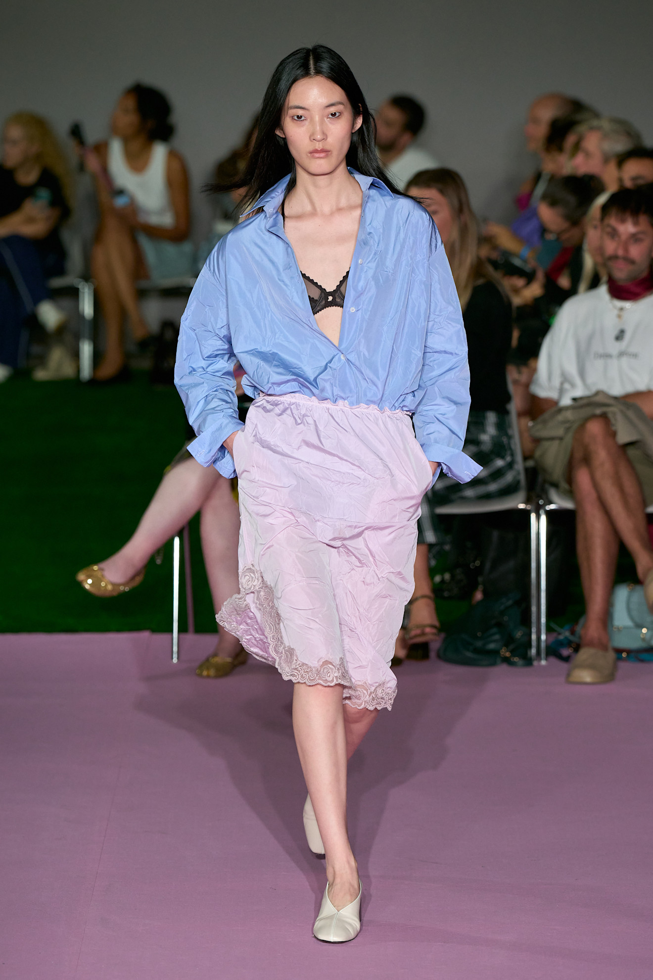Spring/summer 2027 model wearing a bra top on the runway during fashion month.