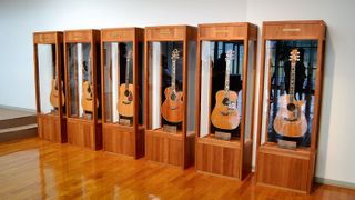 Exhibition-grade guitars, with exquisite designs inspired by nature, adorn the foyer of the factory