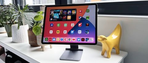 Lululook Foldable Magnetic iPad Stand on a bedside table with iPad Pro