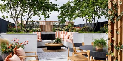 Backyard furniture upholstered in orange deckchair stripes