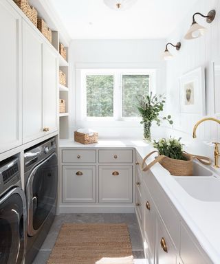 laundry with white cabinets