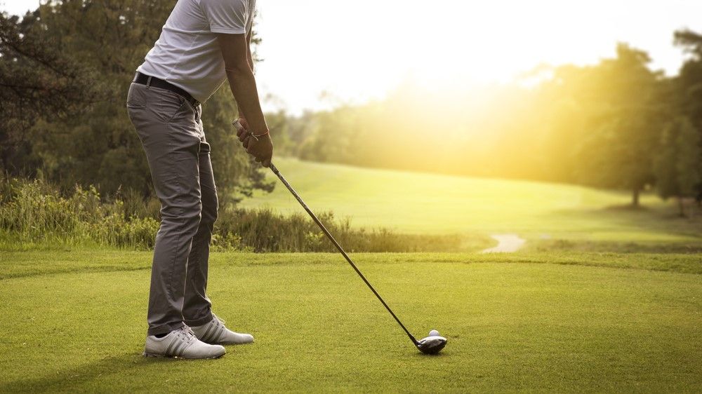 a photo of a man playing golf