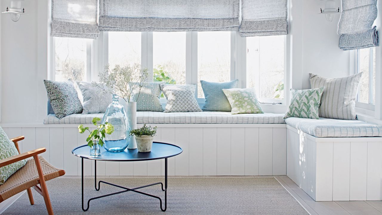 bright seating space with pillows and coffee table