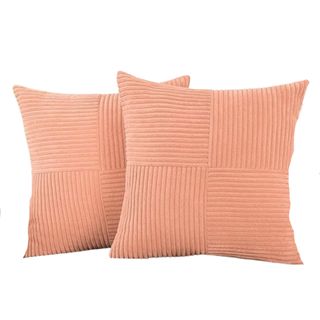 Two peach square throw pillows