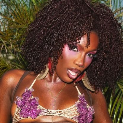 Doechii wore an itty-bitty mesh bralette to perform at Lollapalooza in Brazil