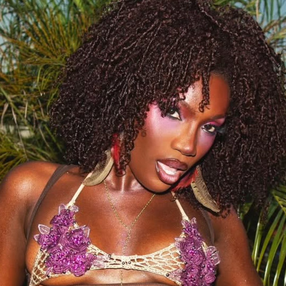 Doechii wore an itty-bitty mesh bralette to perform at Lollapalooza in Brazil 