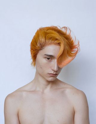 man with orange combed over hair