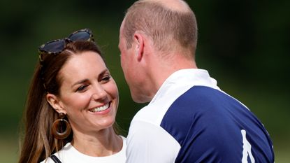 Kate Middleton Prince William kiss - Catherine, Duchess of Cambridge embraces Prince William, Duke of Cambridge during the prize-giving of the Out-Sourcing Inc. Royal Charity Polo Cup at Guards Polo Club, Flemish Farm on July 6, 2022 in Windsor, England.
