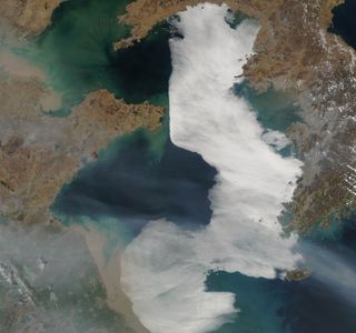 A dense blanket of fog curls against the North Korean coast and across the Yellow Sea in a satellite image captured on March 28, 2012.