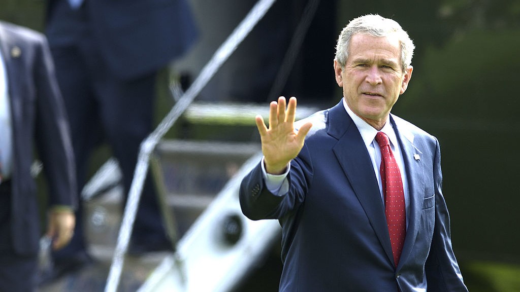 President George W. Bush waving as he walks by Marine One to the Oval Office in 2005
