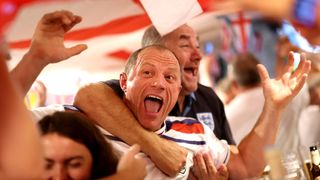 Fans of England celebrate after Cole Palmer of England (not pictured) scores his team's first goal as England face Spain in the men's UEFA Euro 2024 final on July 14 (Carl Recine/Getty Images)