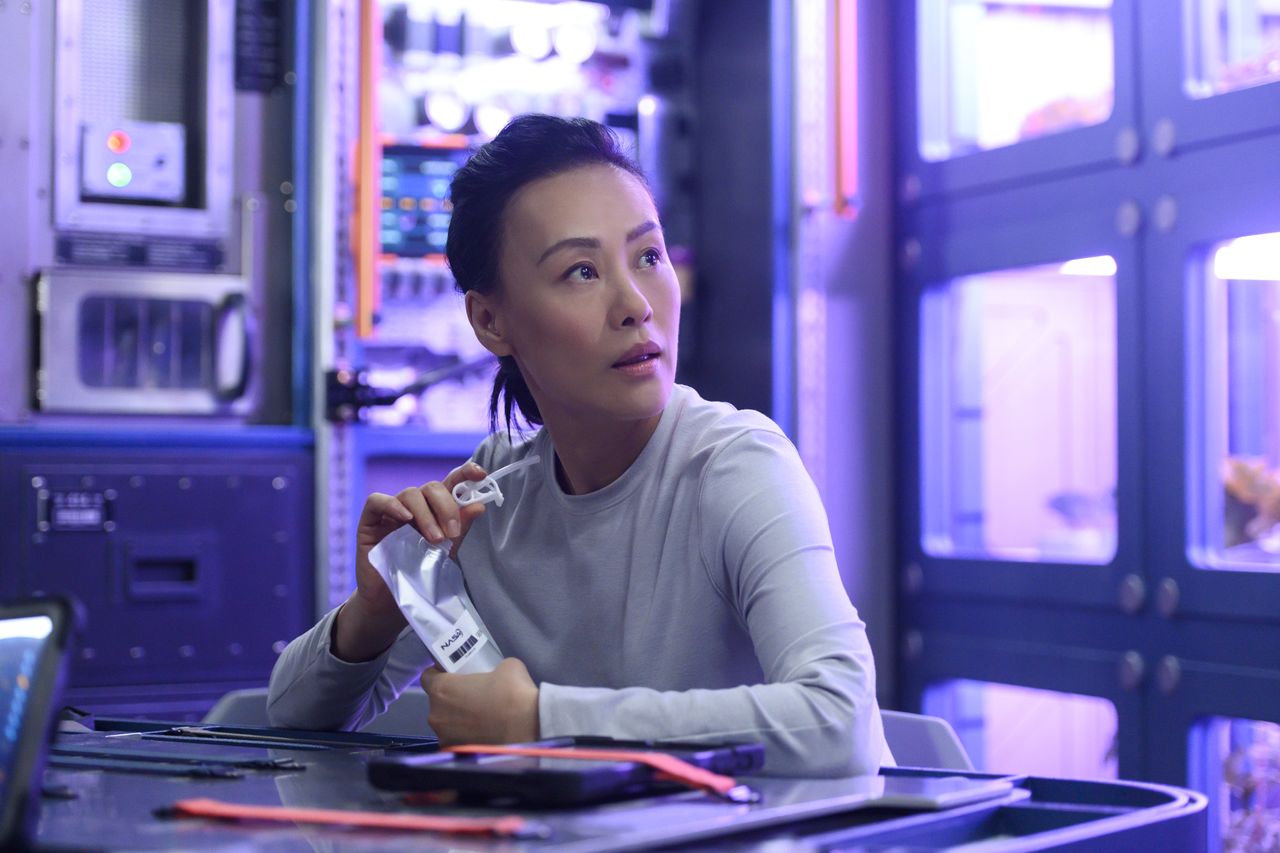 Lu (Vivian Wu) has some space refreshments aboard the Atlas in "Away."