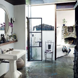 bathroom with white wall and mosaic floored