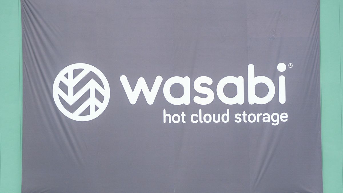 A photo of the Wasabi logo on a flag with the subtitle &quot;Hot cloud storage&quot;. Decorative: the flag is black, while the Wasabi logo is white.