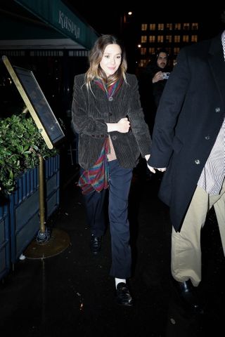 Elizabeth Olsen holding hands with her husband in Paris after dinner with Mary-Kate and Ashley at Caviar Kaspia.