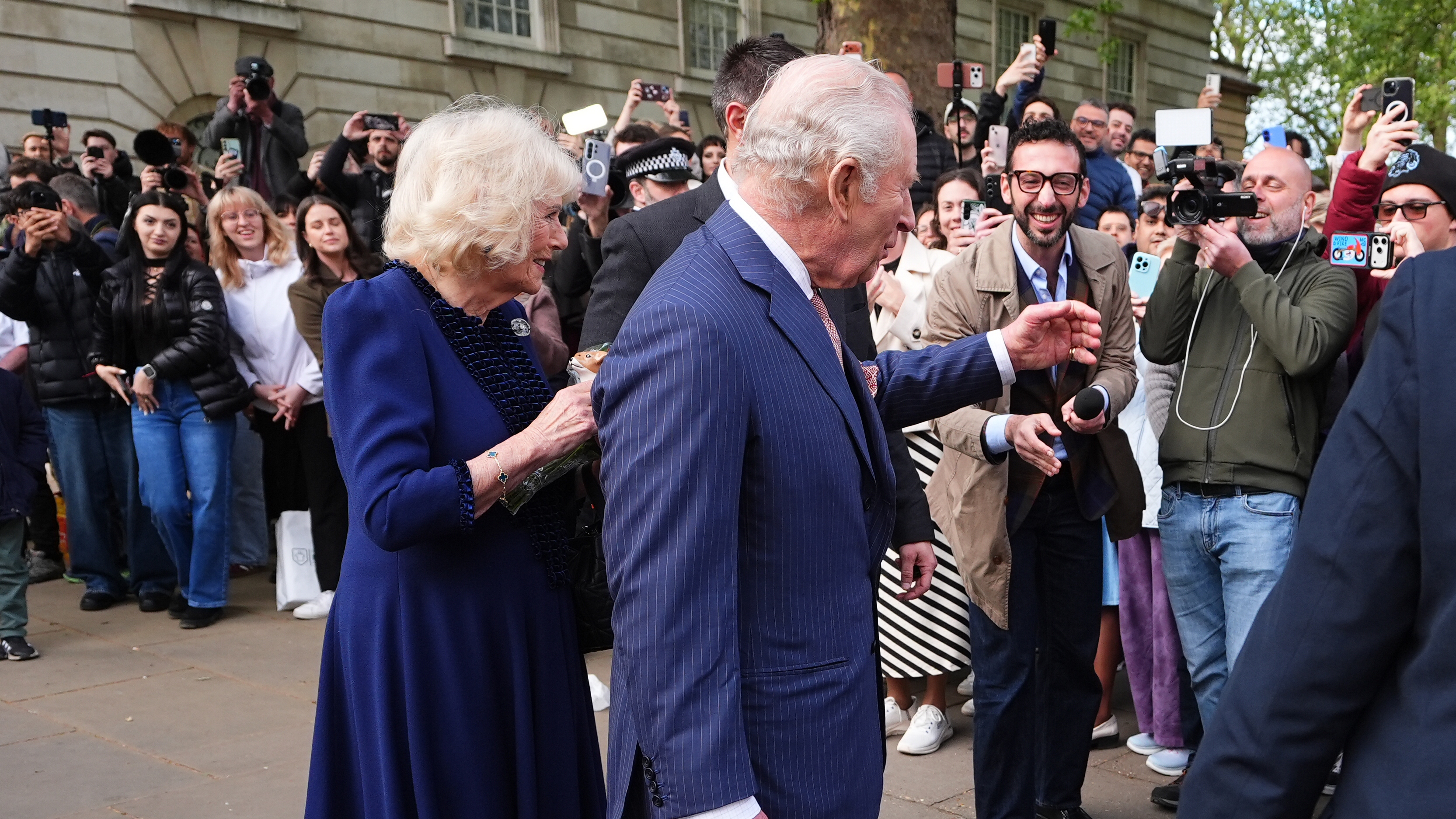 King Charles III and Queen Camilla greet the crowds after a visit to the Queen Elizabeth II: Her Life in Style exhibition