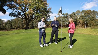 Golfers discussing a Rules issue