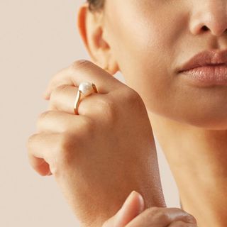 close up of woman's hands wearing rings 