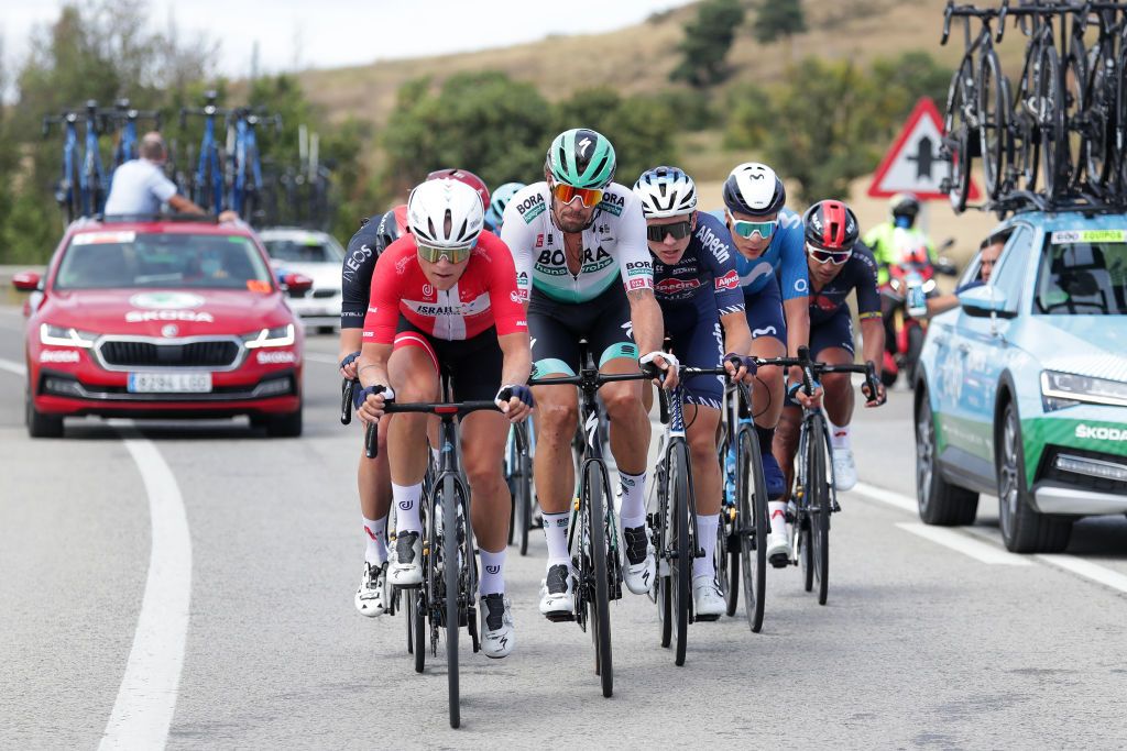 BURGOS SPAIN AUGUST 03 LR Mads Wrtz Schmidt of Denmark and Team Israel StartUp Nation Daniel Oss of Italy and Team Bora Hansgrohe Tobias Bayer of Austria and Team AlpecinFenix in the Breakaway during the 43rd Vuelta a Burgos 2021 Stage 1 a 161km stage from BurgosCatedral to BurgosAlto del Castillo 980m VueltaBurgos BurgosCycling CapitalMundialdelCiclismo catedral2021 on August 03 2021 in Burgos Spain Photo by Gonzalo Arroyo MorenoGetty Images