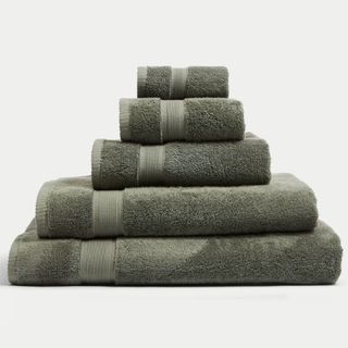 Pile of five moss green towels