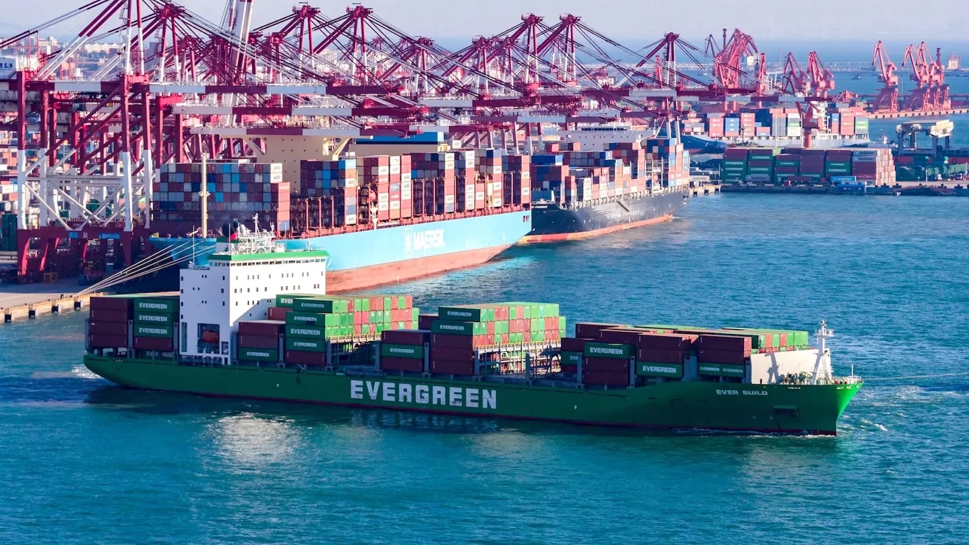 a photo of a container ship near a port