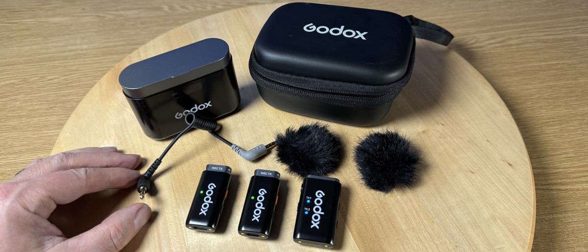 Godox WEC microphone laid out on a wooden table