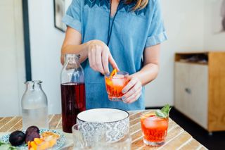 woman mixing cocktail