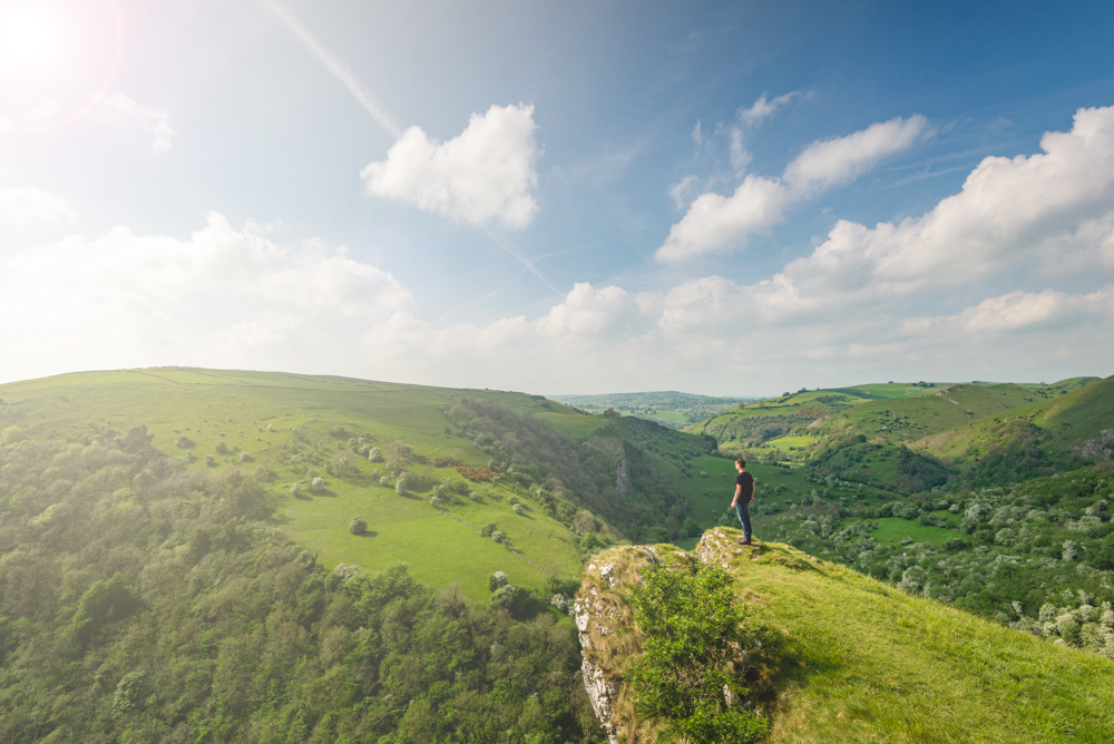 A man overlooking some rolling hills