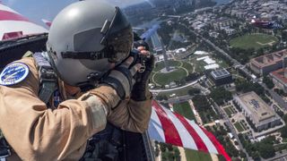 Photographer takes aerial picture of Washington, D.C from backseat of fighter jet aircraft. 