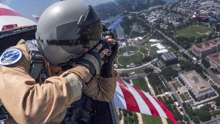 Photographer takes aerial picture of Washington, D.C from backseat of fighter jet aircraft. 