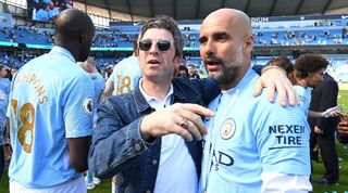Musician Noel Gallagher pictured with Manchester City manager Pep Guardiola after a game against Huddersfield in May 2018.