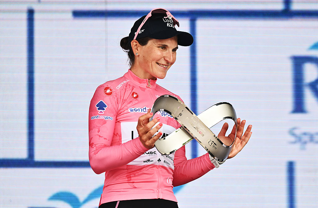 IMOLA, ITALY - JULY 13: Elisa Longo Borghini of Italy and UAE Team ADQ - Pink Leader Jersey celebrates at podium as overall final race winner during the 36th Giro d'Italia Women 2025, Stage 8 a 134km stage from Forli to Imola / #UCIWWT / on July 13, 2025 in Imola, Italy. (Photo by Luc Claessen/Getty Images)