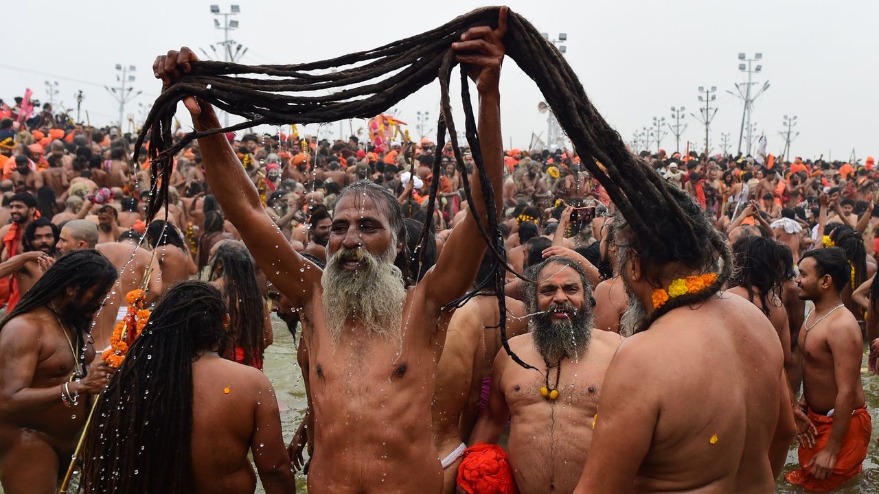 Naga Sadhus take a holy dip at Sangam, confluence of Ganges, Yamuna and mythological Saraswati rivers