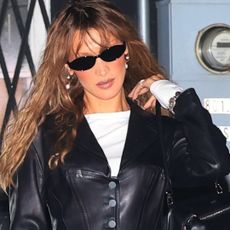 Bella Hadid elevated straight-leg jeans with leopard-print peep-toe pumps