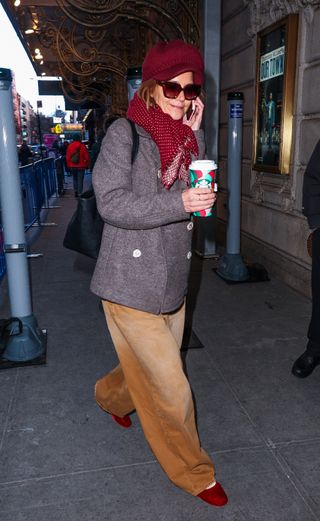 Katie Holmes spotted in New York City in a pair of barrel jeans and a chunky coat