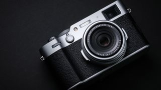 Fujifilm X100VI camera in silver against a dark background