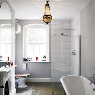 white bathroom with bathtub and shower