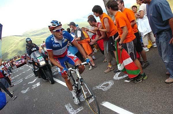 French champ Christophe Moreau fights his way past some Basque fans.
