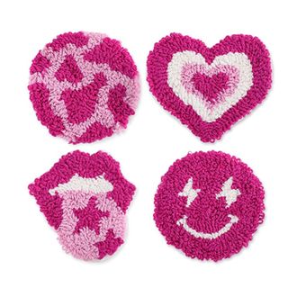 Four pink fluffy coasters