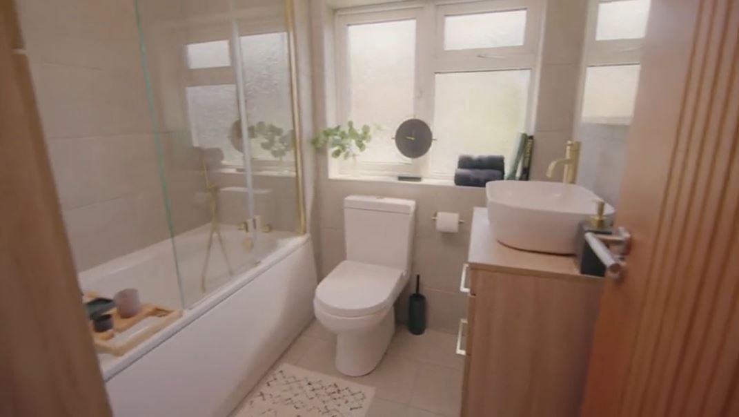 A newly renovated bathroom with cream tiles