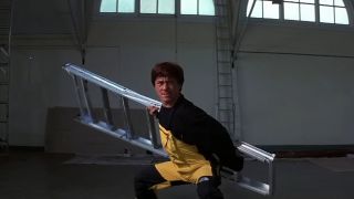 Jackie Chan holding a ladder in Jackie Chan's First Strike