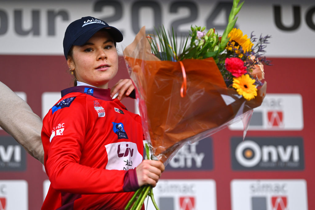 ARNHEM NETHERLANDS OCTOBER 13 Silke Smulders of The Netherlands and Team Liv AlUla Jayco celebrates at podium as Red Most Combative Jersey winner during the 26th Simac Ladies Tour 2024 Stage 6 a 1458km stage from Arnhem to Arnhem UCIWWT on October 13 2024 in Arnhem Netherlands Photo by Luc ClaessenGetty Images