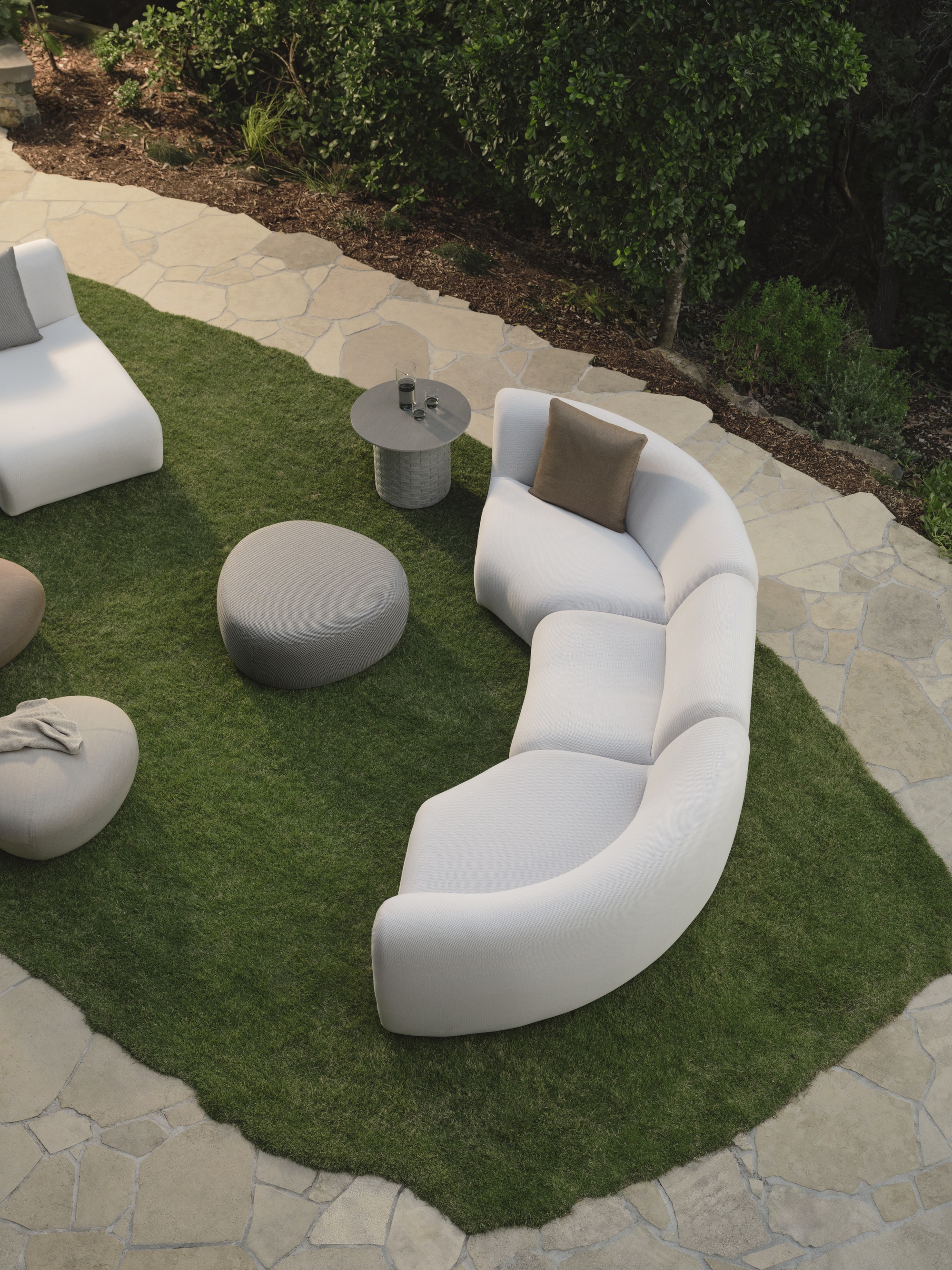 King Living 1977 Outdoor Sofa in garden with stone path