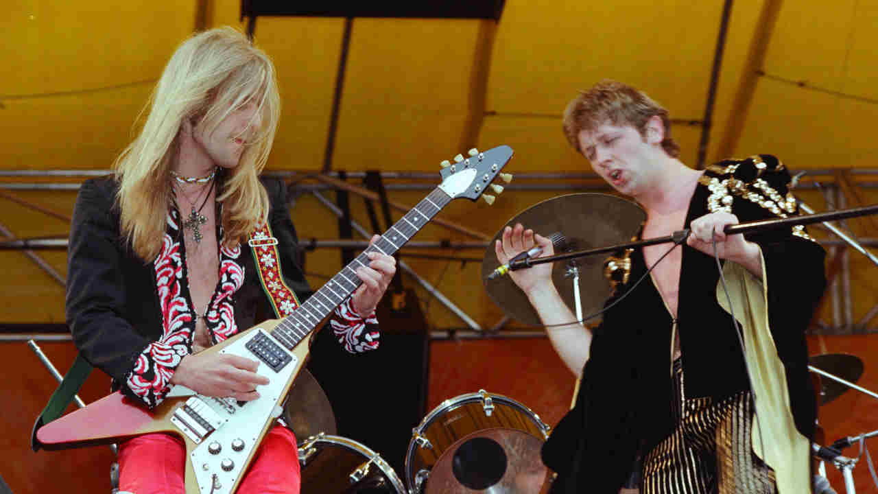 Judas Priest performing onstage in the 1970s
