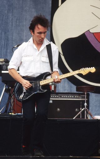 Guitarist The Edge aka David Howell Evans performs with U-2 at the US Festival in Devore, California on May 28, 1983.